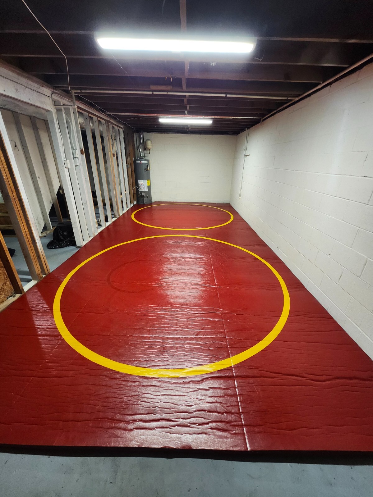 A relevant stock photo of wrestling mats for sale in a typical setting.