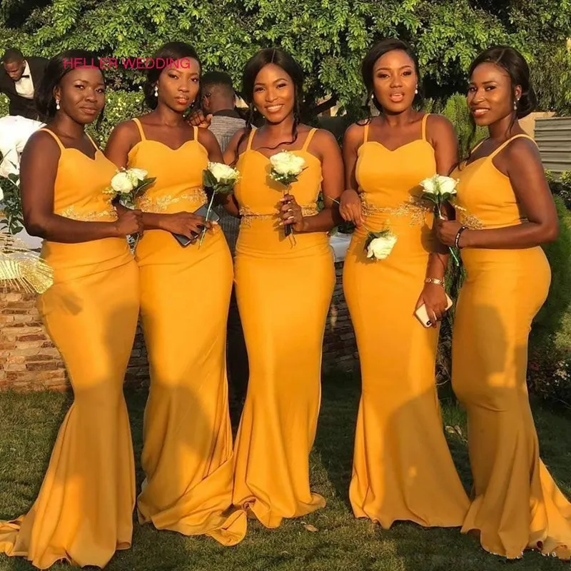 A relevant stock photo of yellow bridesmaid dresses in a typical setting.
