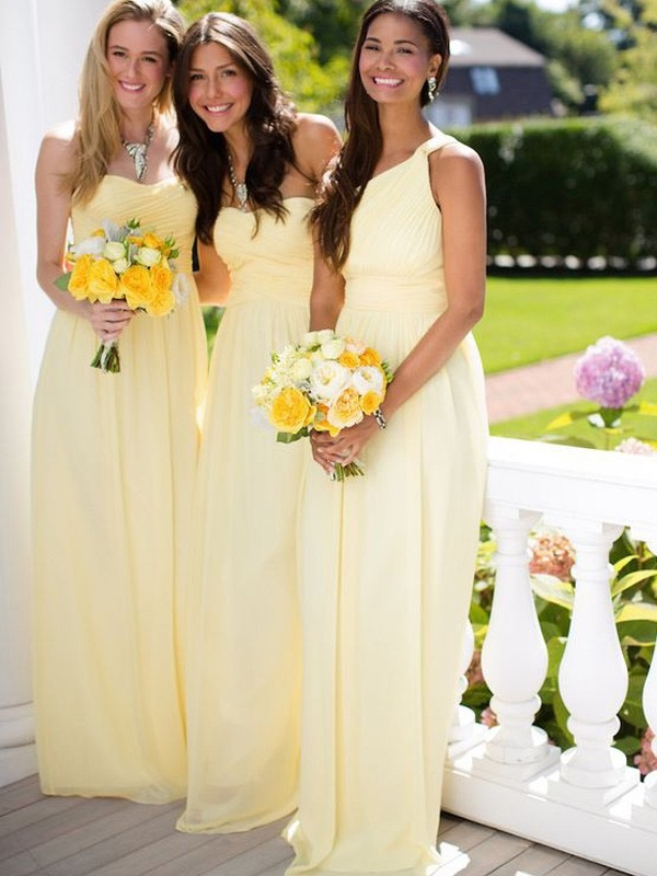 A relevant stock photo of yellow bridesmaid dresses in a typical setting.